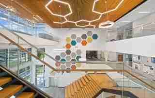 Three-story atrium staircase at FIT Health Sciences Center