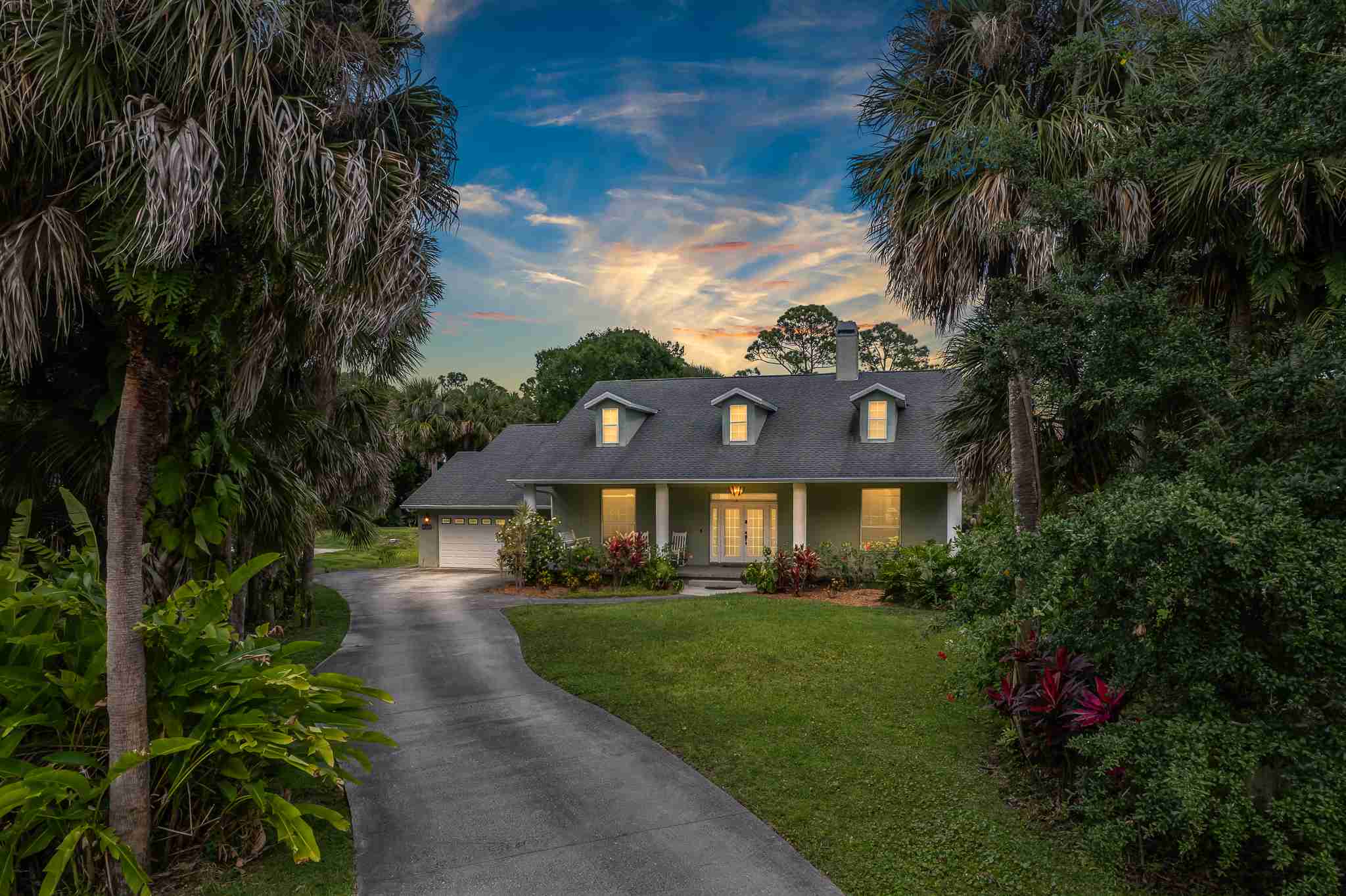 5283 Winding Way Merritt Island FL 32953 Exterior of a home in Merritt Island Florida with twilight lighting